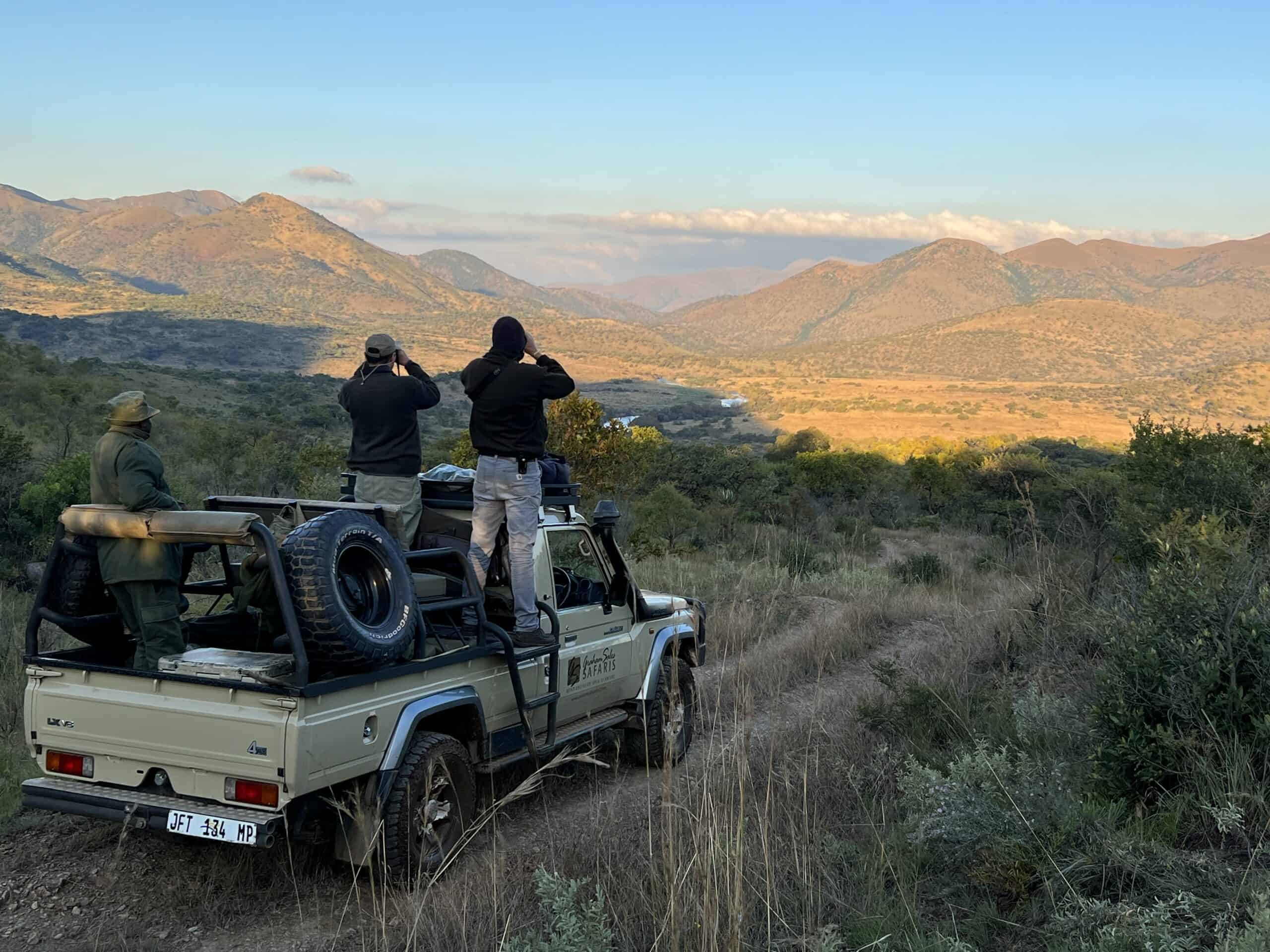 Hunting the African Eland: The King of plains game Tourists on safari vehicle observing landscape and wildlife in Africa.