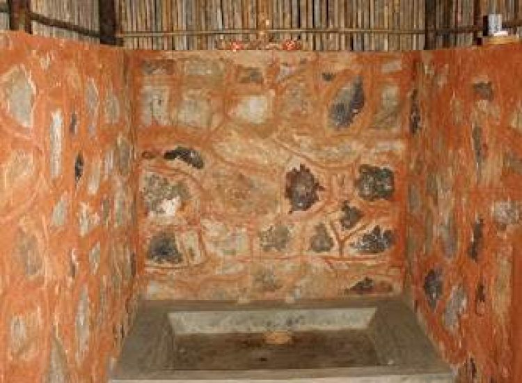 Mozambique Hunting Rustic outdoor shower with stone and brick walls in Mozambique.